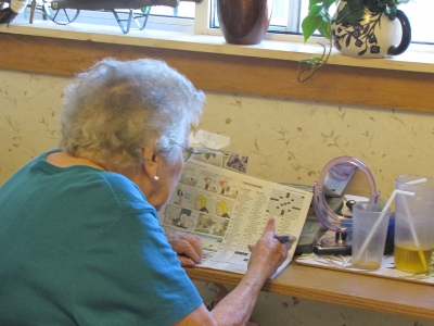 Mary Thurber doing crossword